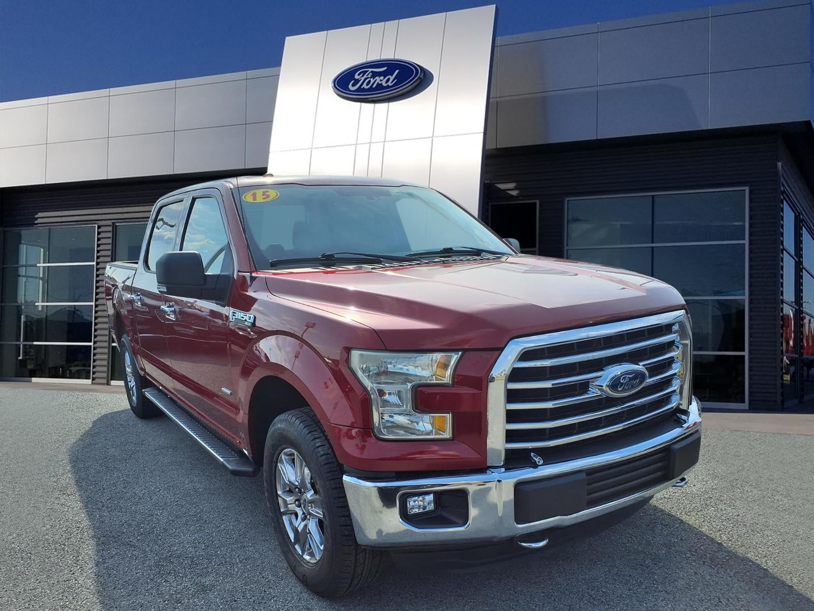2015 Ford F-150 XLT in Race Red — front three-quarter view